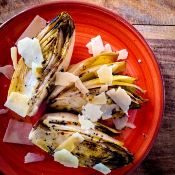 Grilled endive salad with parmesan and homemade poppy seed dressing.