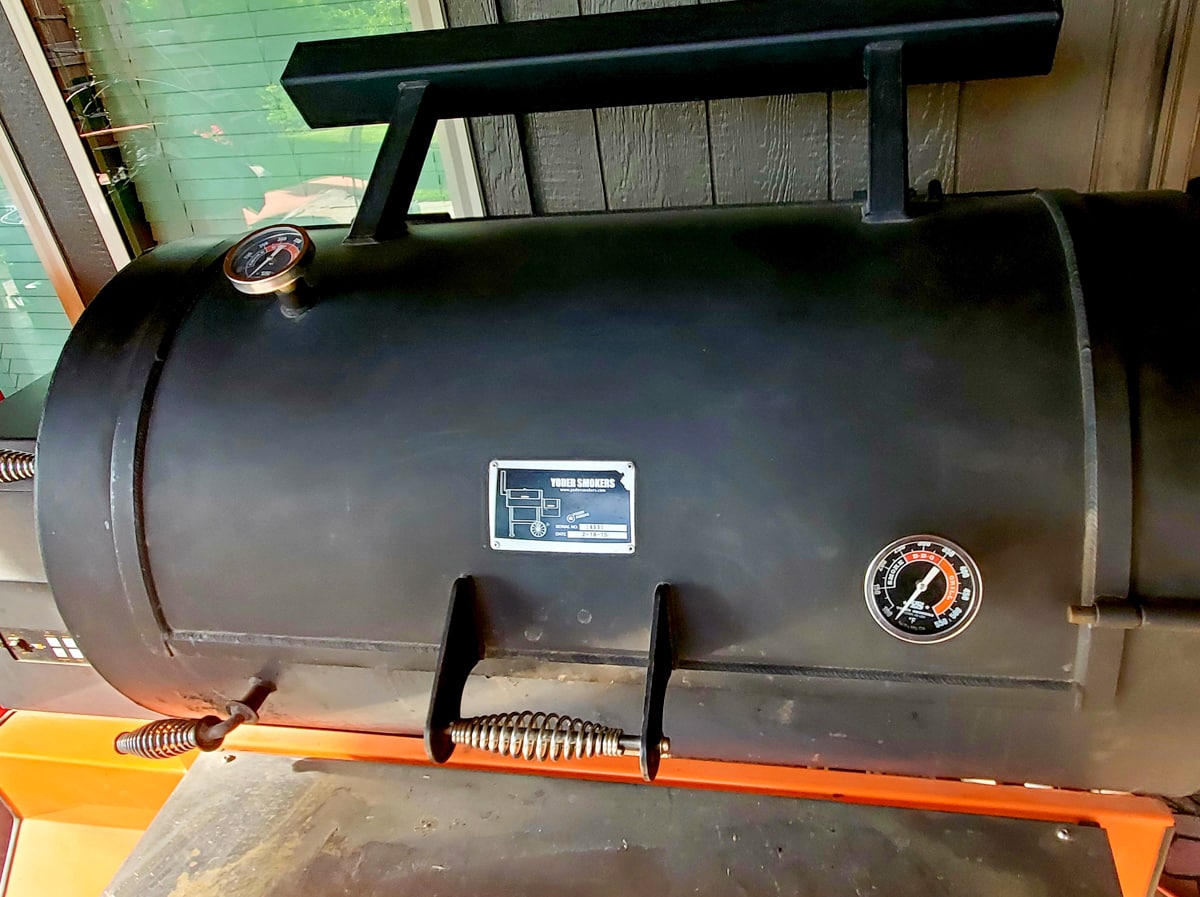 Yoder Pellet Smoker on a patio.