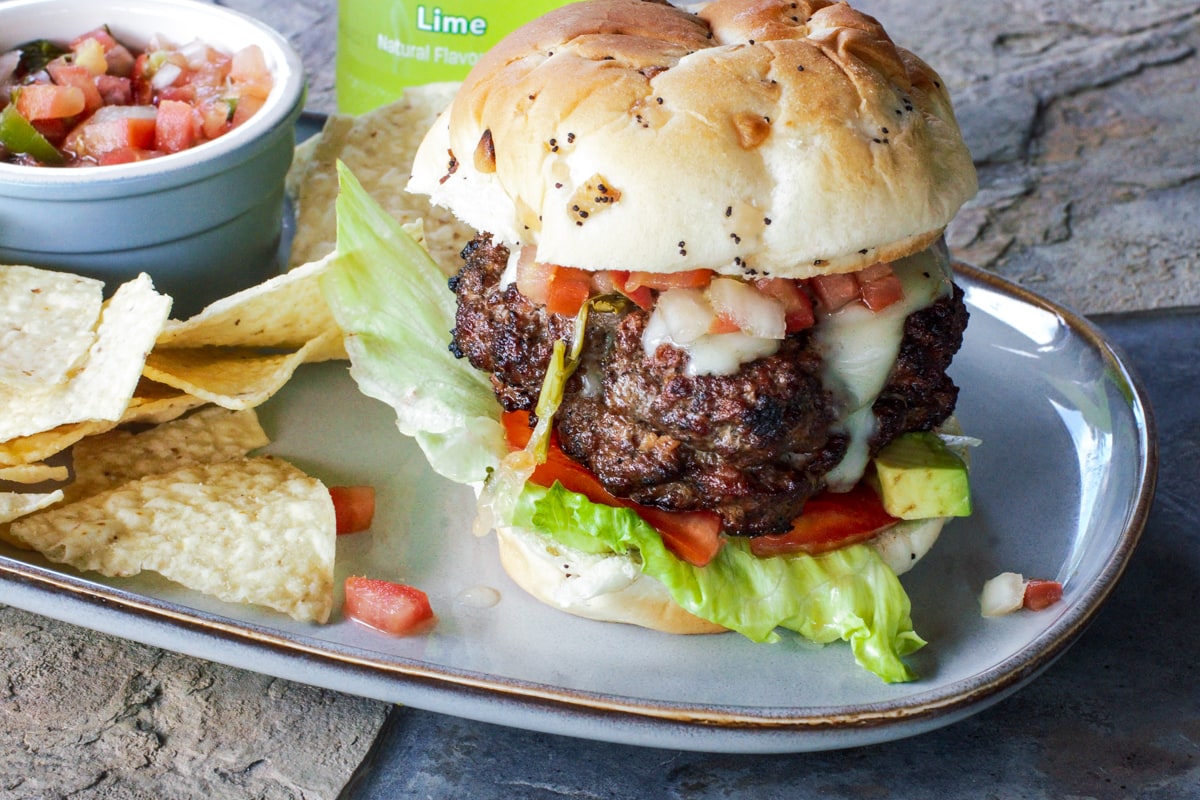 Thick, stuffed Mexican Burger served with chips and salsa.