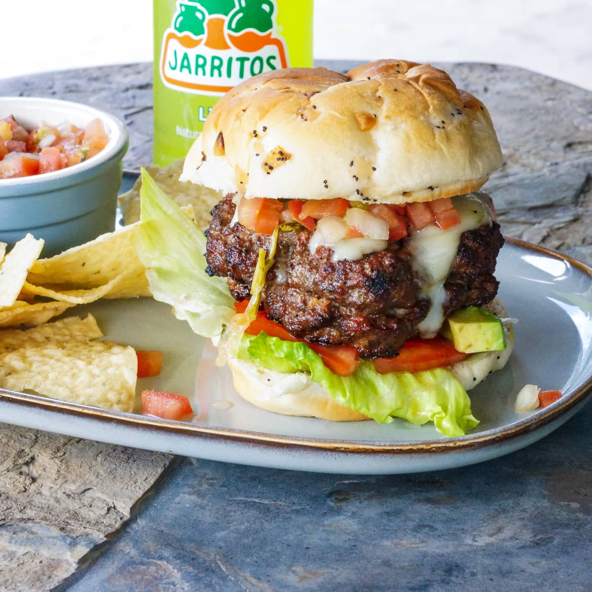 Mexican thick burger, topped with avocado and pico de gallo.