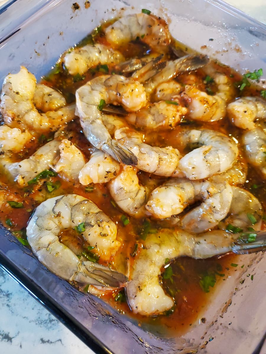 Marinating basil shrimp in a pan.