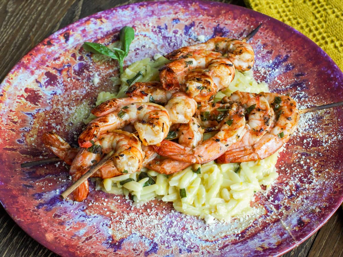 Grilled basil shrimp with orange and basil orzo.