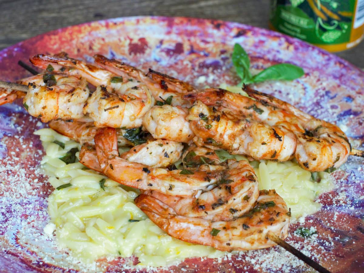 Grilled Mediterranean shrimp skewers with orzo pasta.