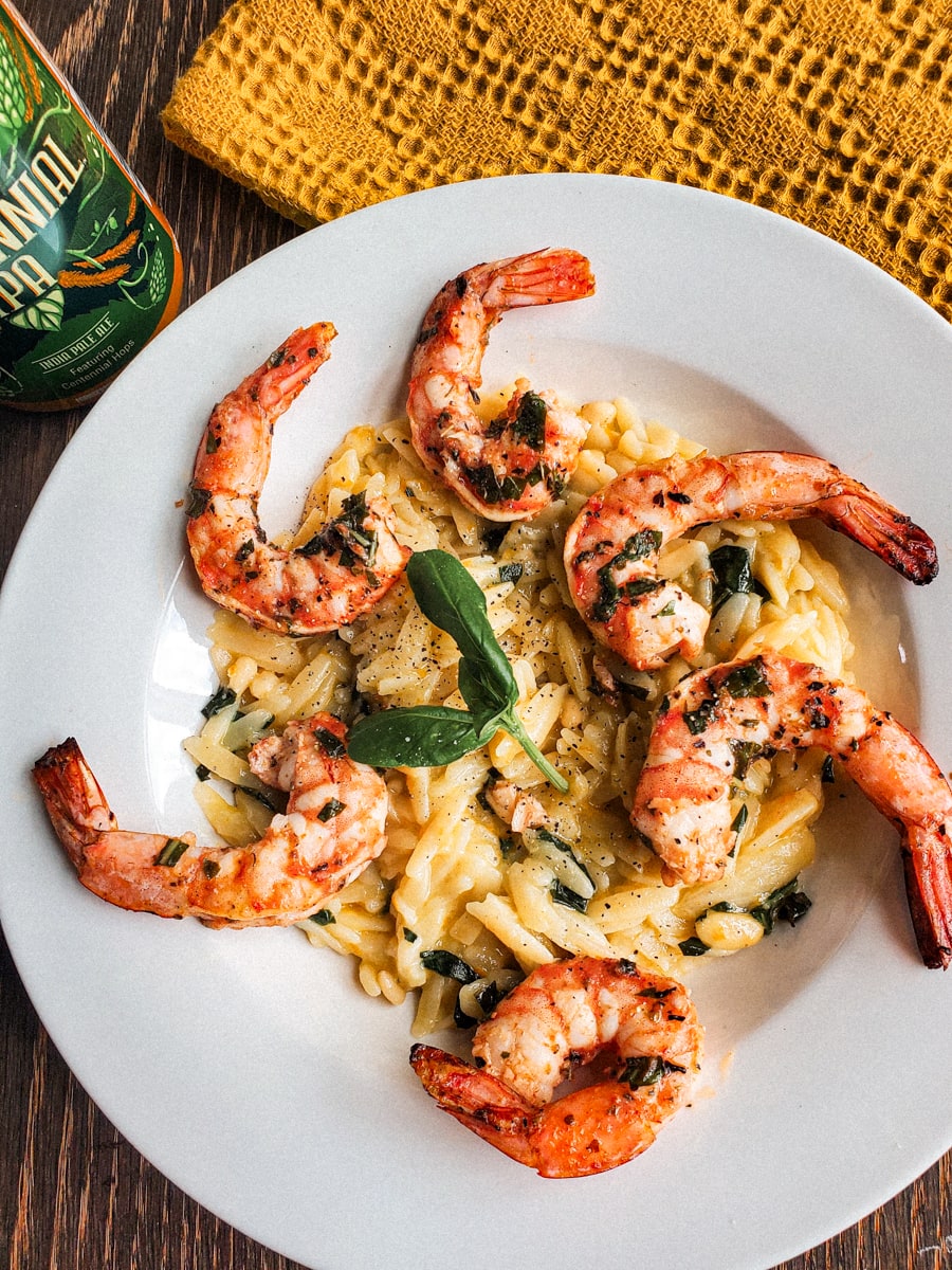 Plate with grilled shrimp and orzo.