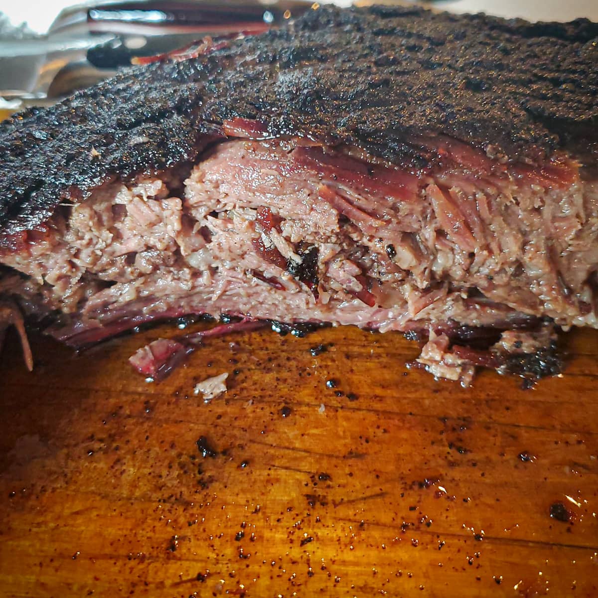 Smoked brisket point on a cutting board.