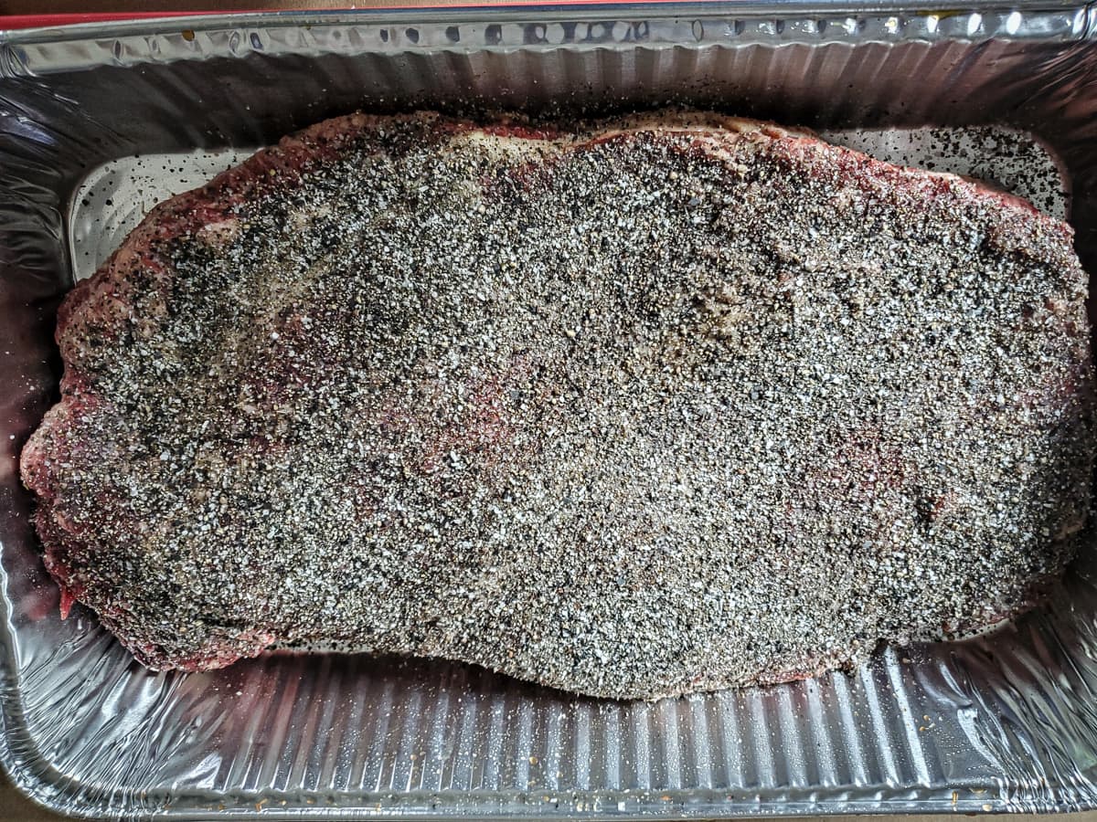 Packer brisket seasoned with salt and pepper.