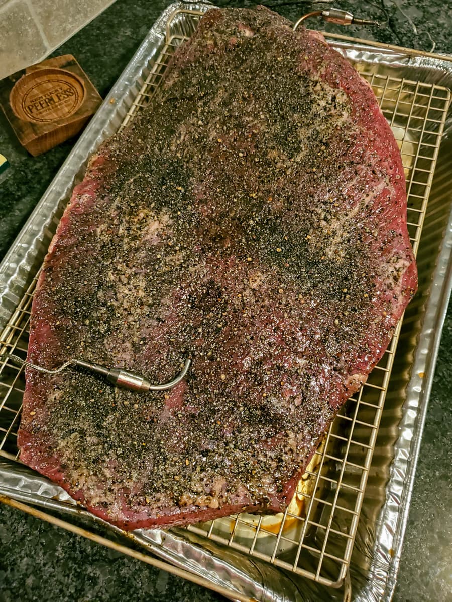 Seasoned packer brisket ready for the smoker.