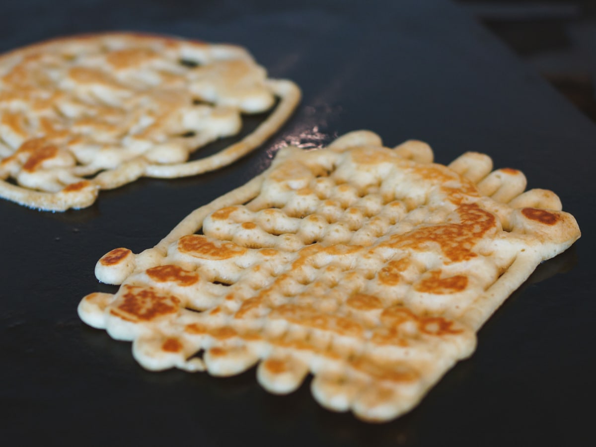Homemade funnel cakes on a Cooking Steel Griddle.