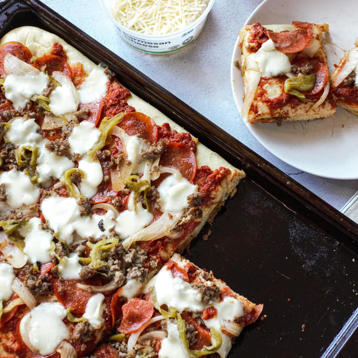 Sheet pan pizza on a counter.