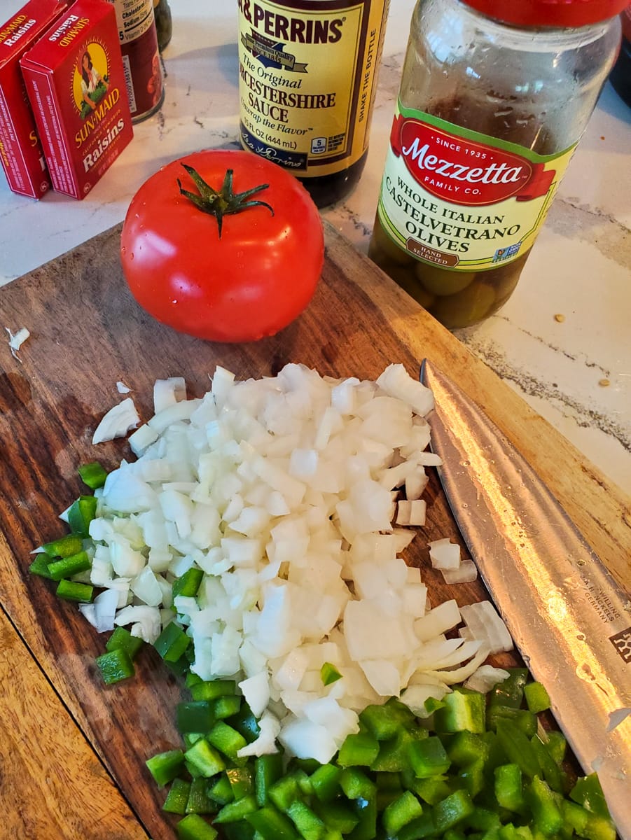 Diced onion on a cutting board.