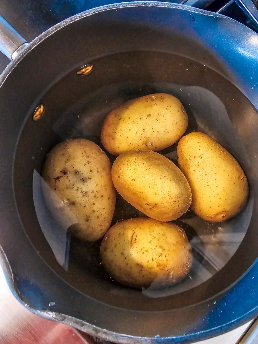 Yellow potatoes in boiling water.