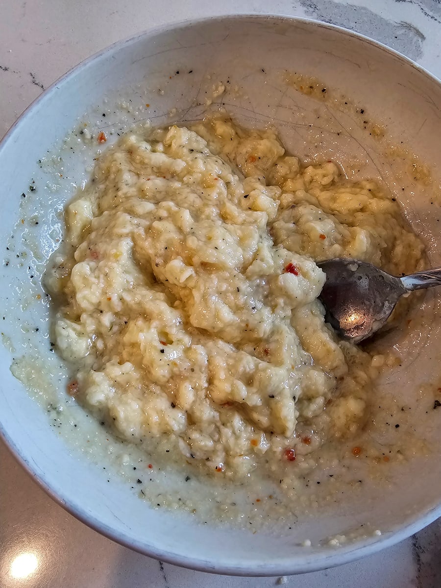 Italian seasoned garlic butter in a bowl.