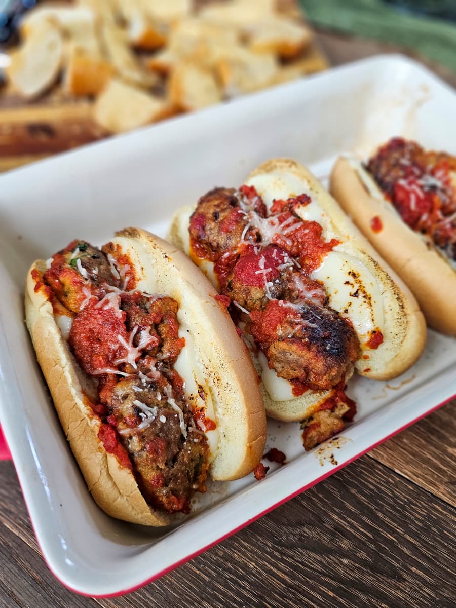 Meatball subs with provolone and meatballs with marinara.