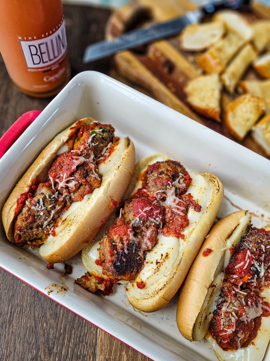 Meatball grinders on a serving tray.