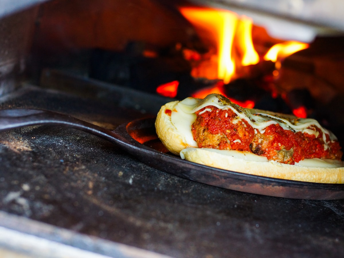 Wood fired meatball sub sandwich in an Ooni pizza oven.