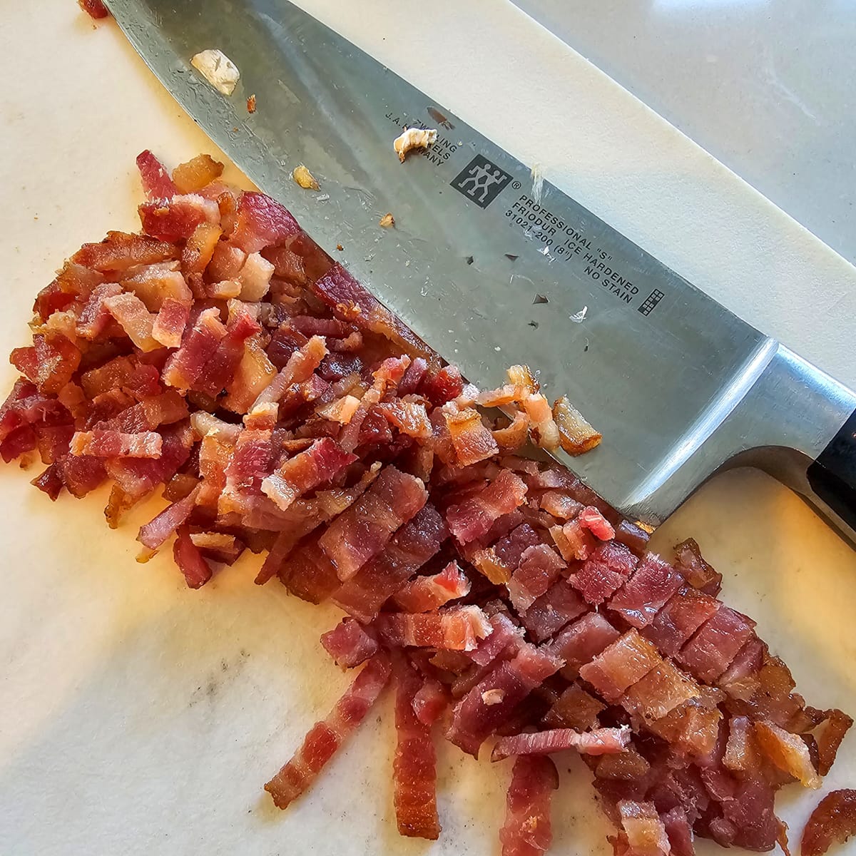 Diced onion on a cutting board.