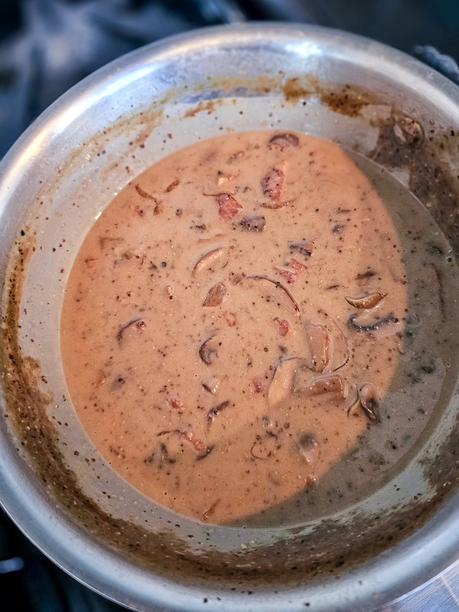 Cream added to a saucepan of German Hunter sauce.