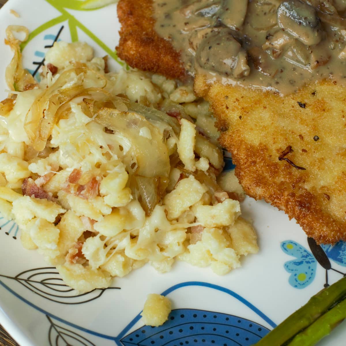 Cheesy spätzle served with Jagerschnitzel.