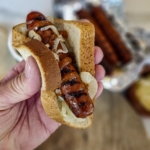 Australian Grilled Sausage Sizzle with homemade ketchup and grilled onions.