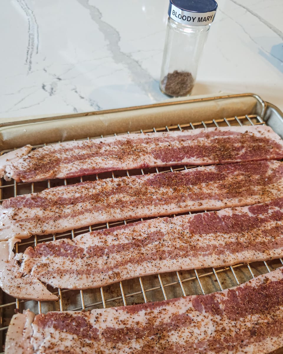 Slices of bacon seasoned with bloody Mary seasoning.