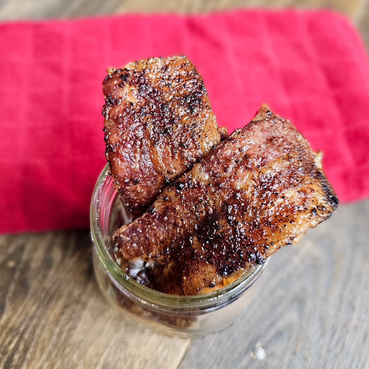 Bacon slices seasoned with Bloody Mary rub.