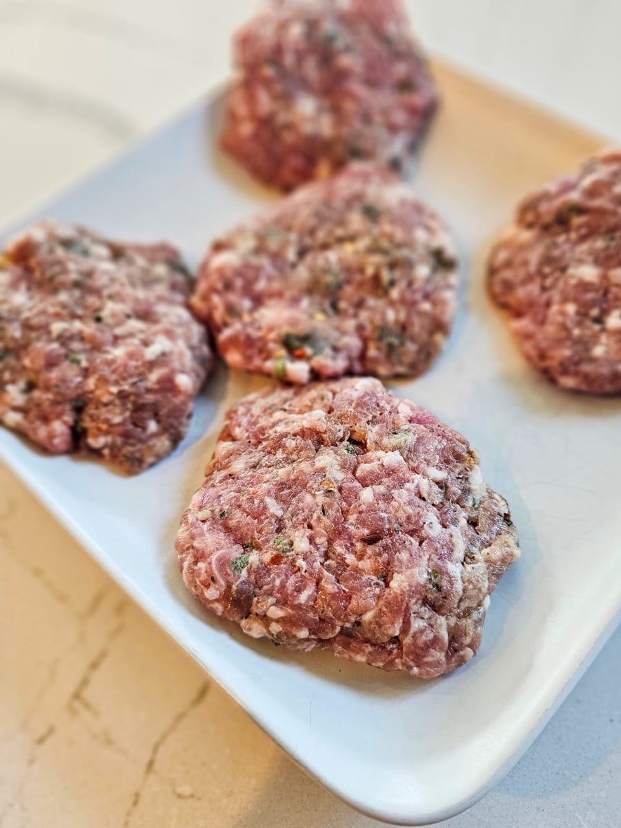 Homemade breakfast sausage patties on a plate.