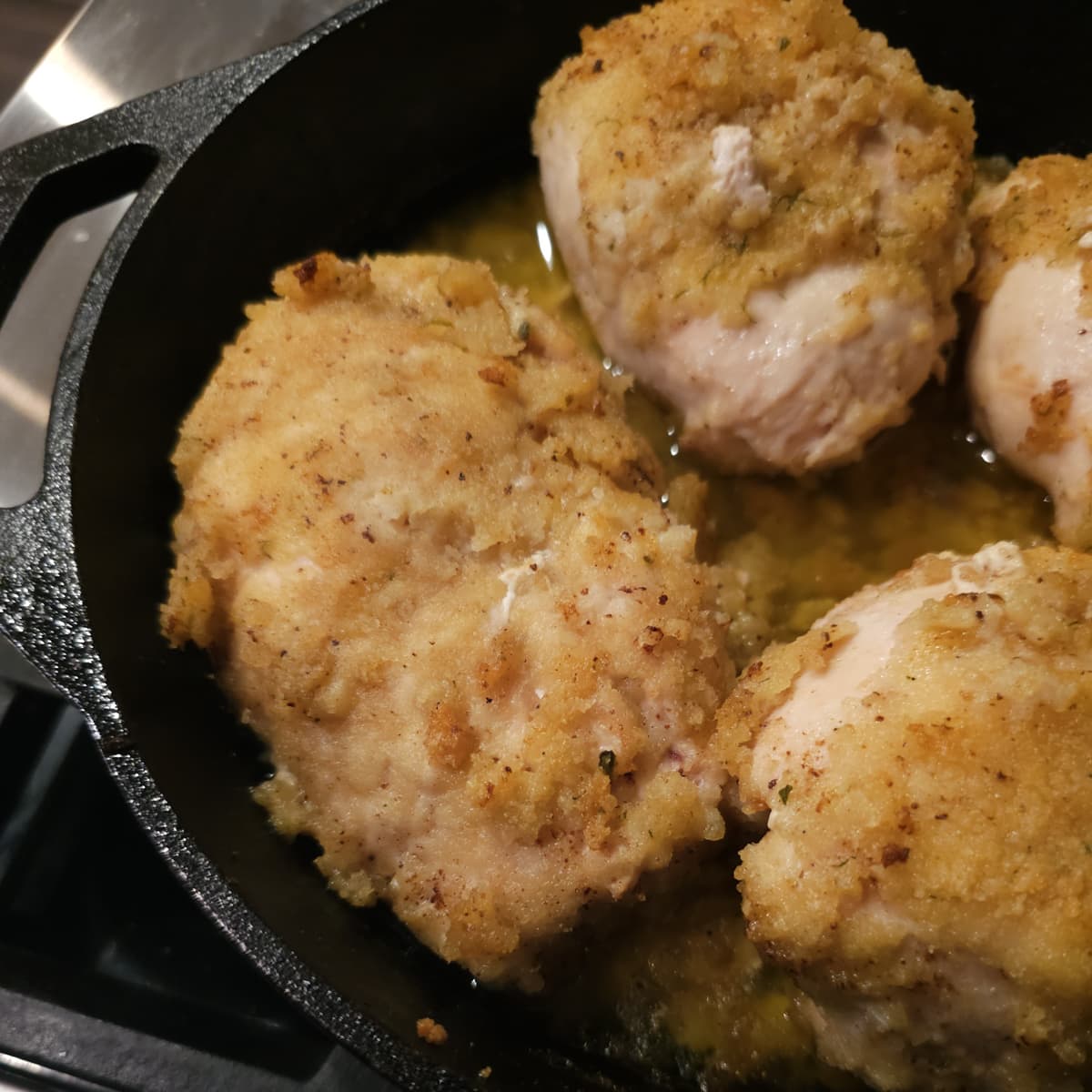 Smoked Chicken Kiev in a cast iron pan.