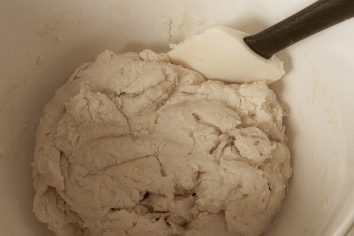 Fry bread dough being mixed in a bowl.