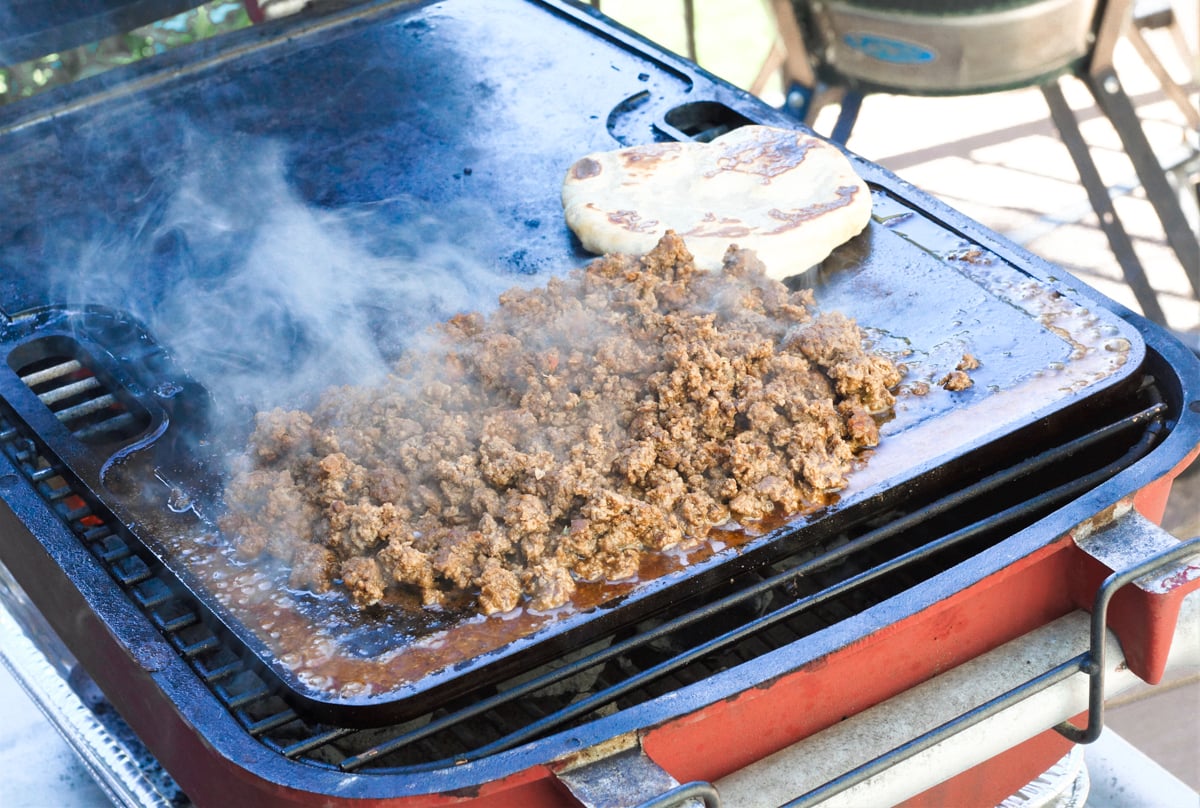 Cooking Navajo tacos on a flat top griddle.