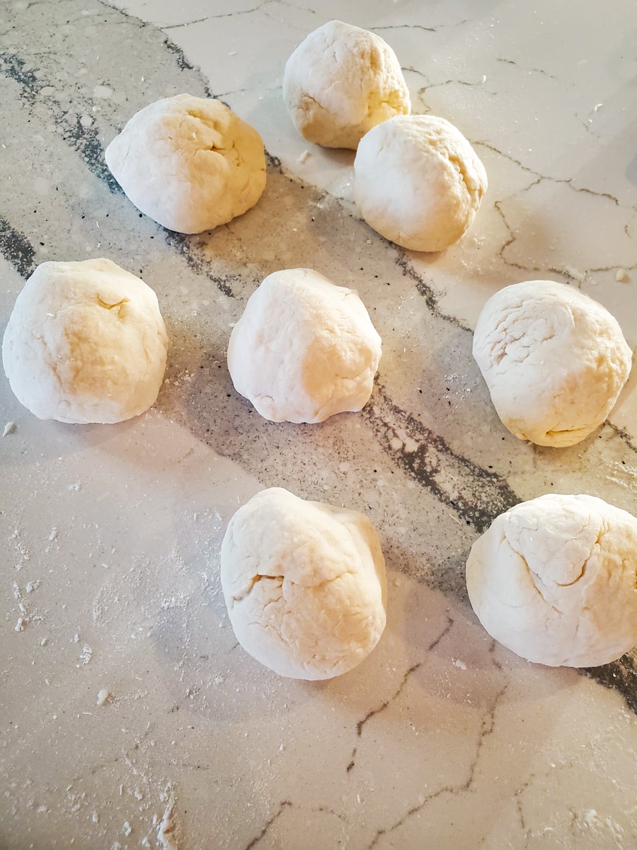 Balls of dough on a countertop