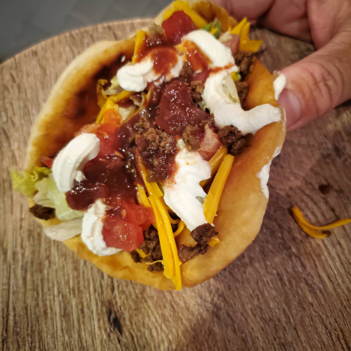 Eating a homemade Indian fry bread taco.