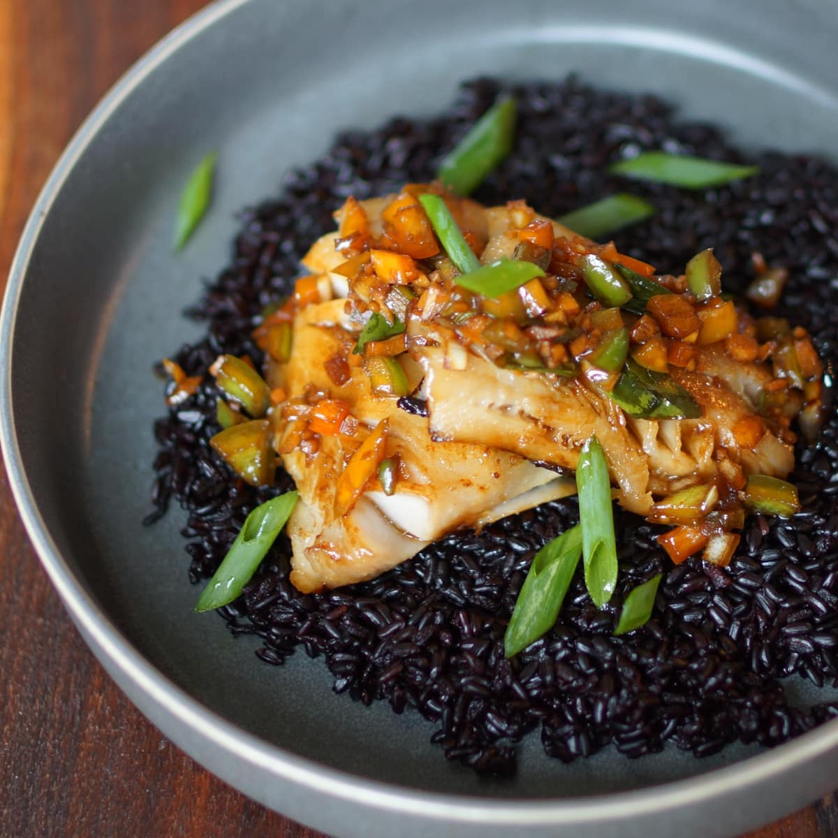 Miso marinated black cod with pepper, onion and daikon vinaigrette served over forbidden rice.