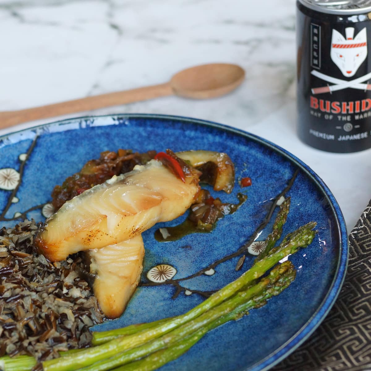 Roy's inspired miso butterfish served with wild rice and asparagus.