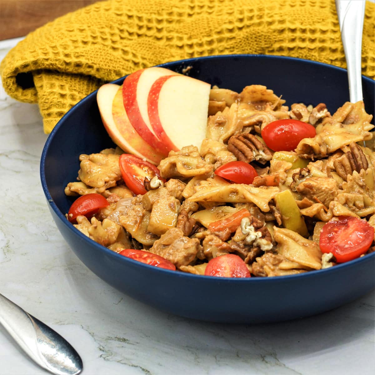Bowtie Chicken pasta with a balsamic mascarpone sauce, apples, pecans, and prosciutto.