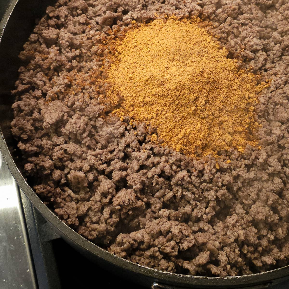 Browned ground beef seasoned with taco seasoning.