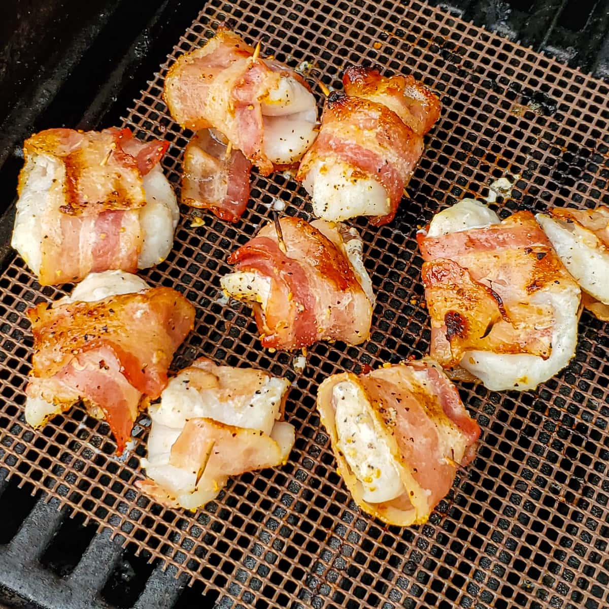 Bacon wrapped halibut bites on a Big Green Egg.