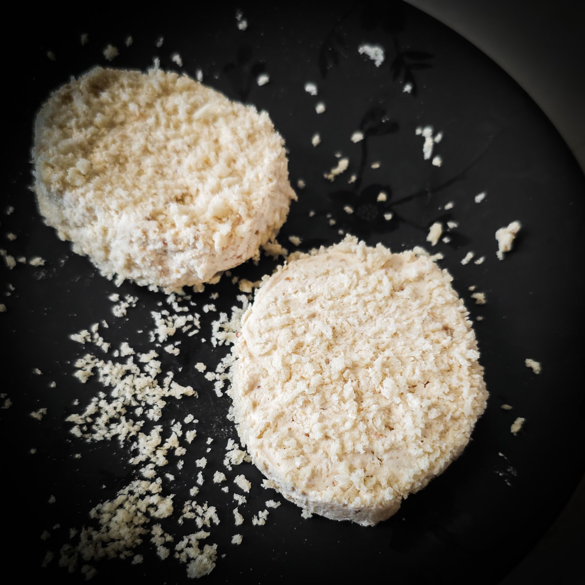 Slices of Boursin cheese coated with panko breadcrumbs.