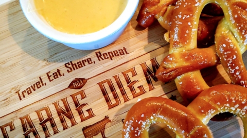 Cup of smoked beer cheese with Bavarian pretzels.