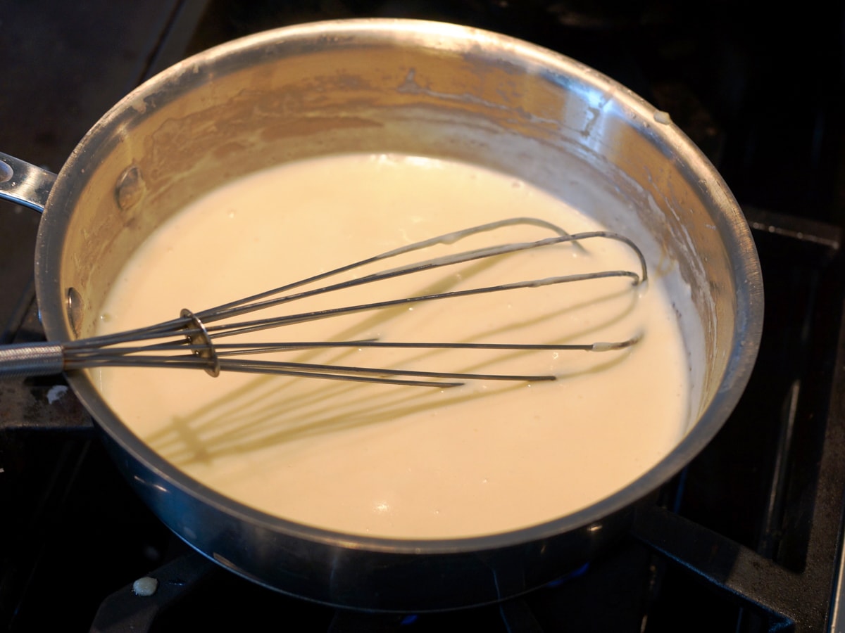 Making a Asiago cream sauce.