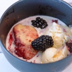 Dutch Oven blackberry slump with fresh blackberries and ice cream.