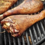 BBQ turkey legs on a smoker.
