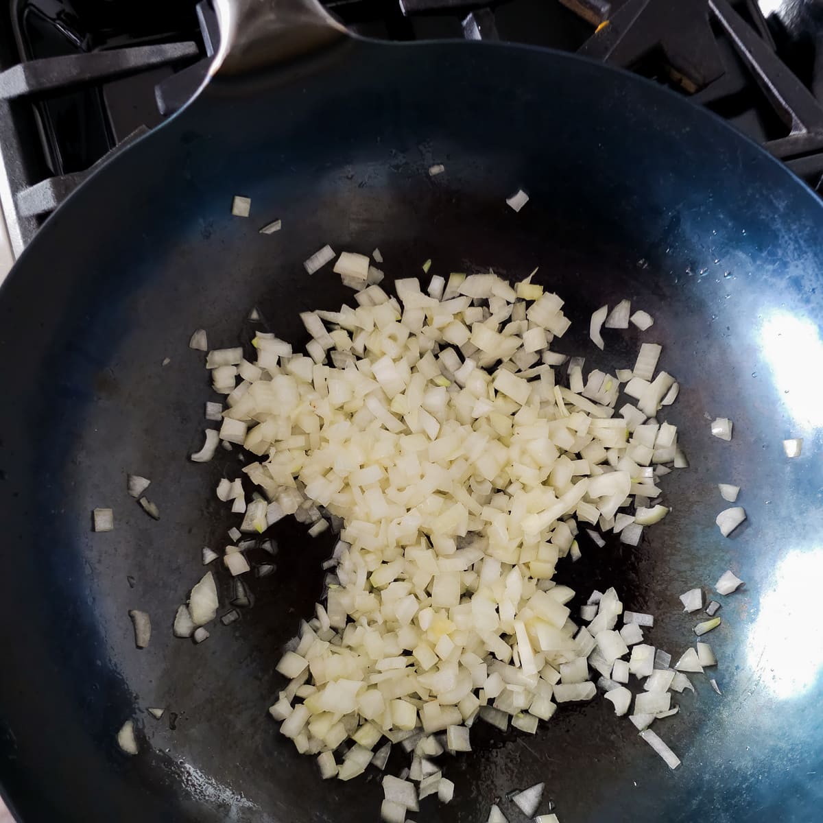 Onion cooking in a wok.
