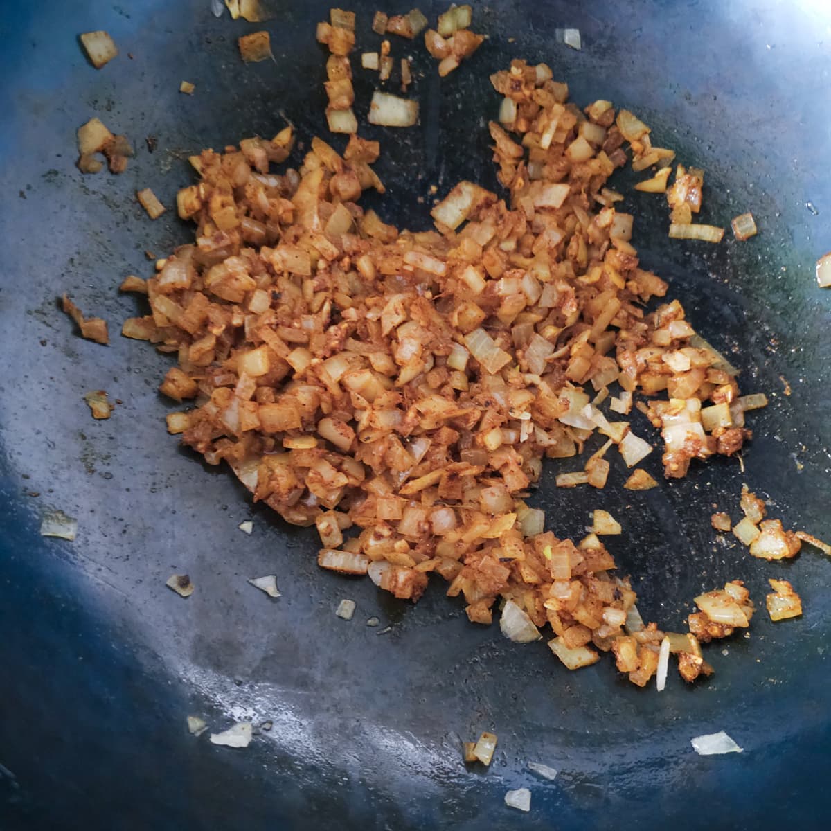 Onion cooking with Indian spice mix.