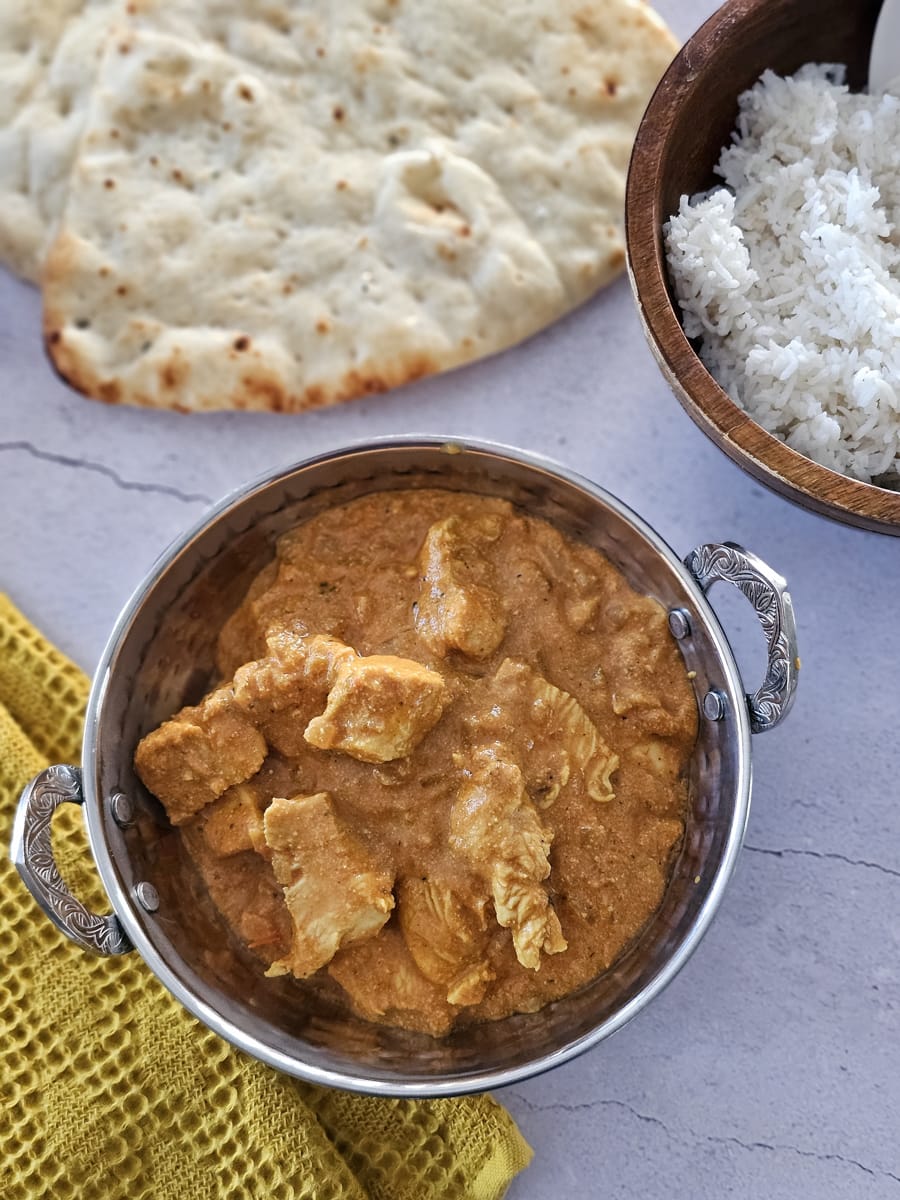 Bowl of Northern Indian style butter chicken, served restaurant style.