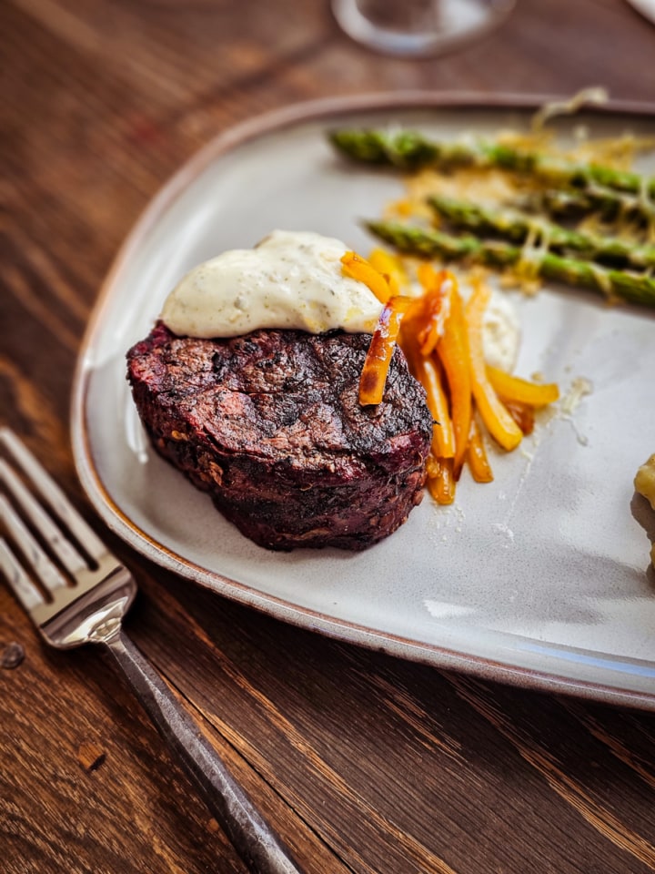 Filet Mignon with Goat Cheese Sauce and Grand Marnier Sautéed Peppers