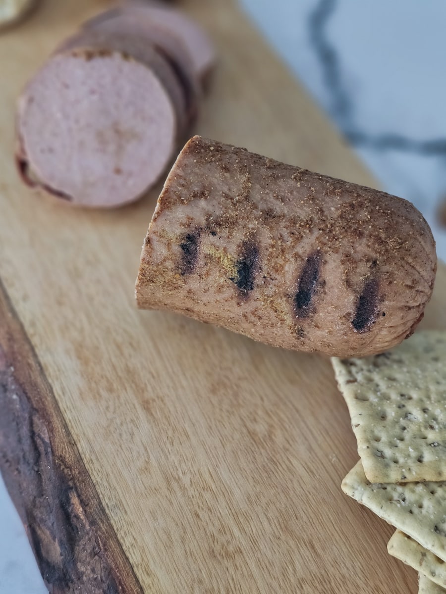 Sweet and spicy smoked  bologna served with crackers.