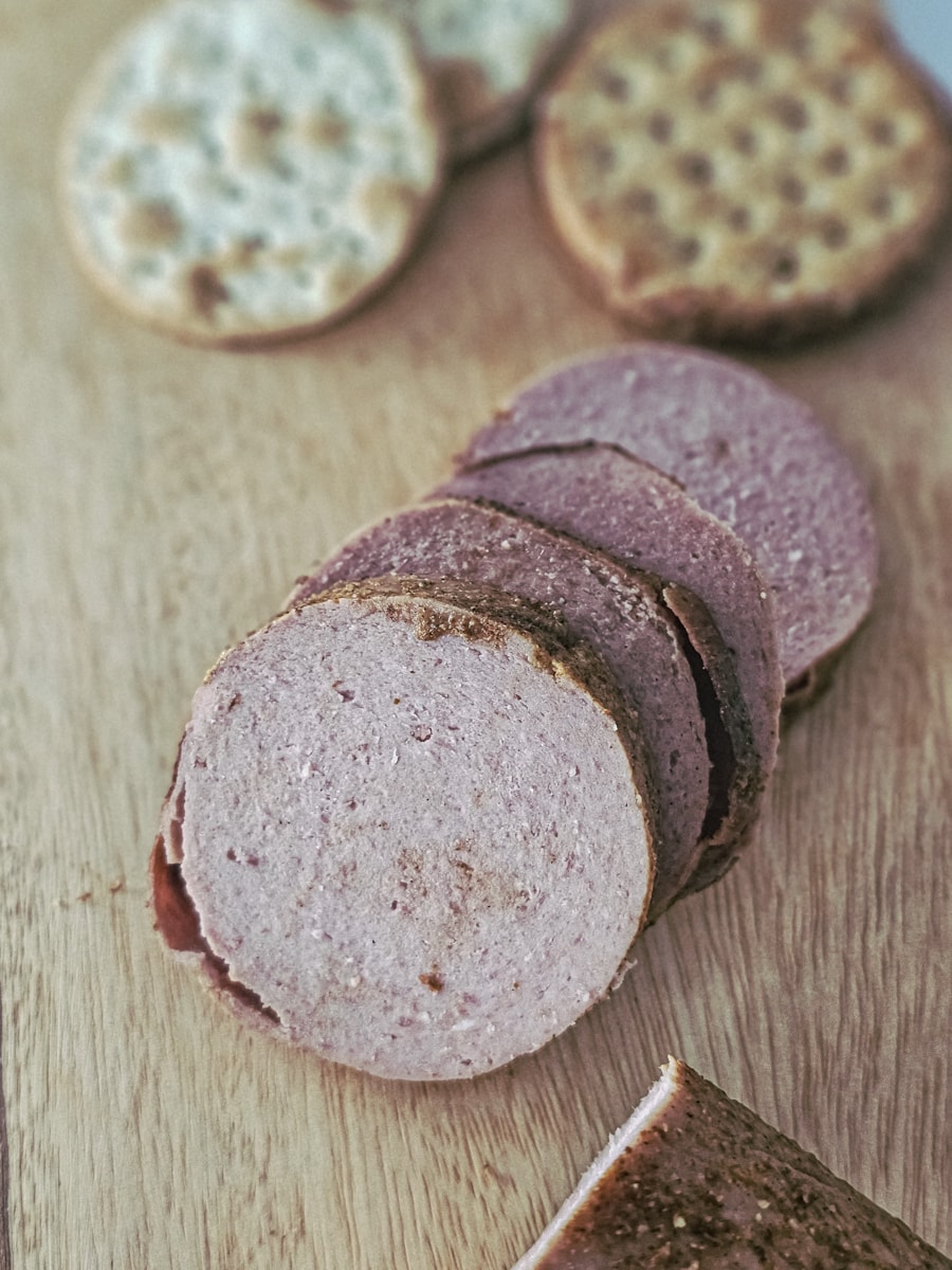 Slices of sweet and spicy smoked bologna served with crackers.