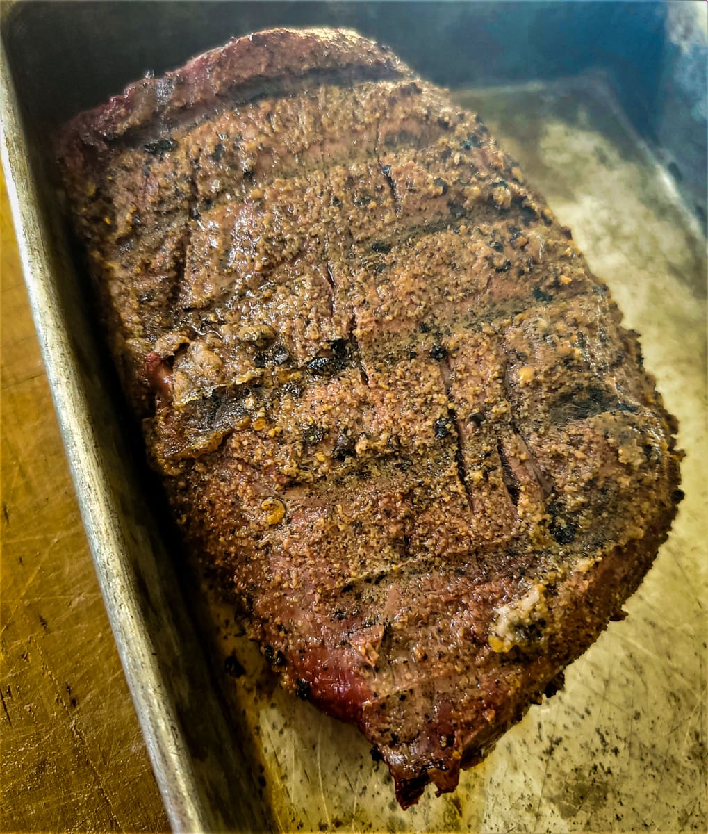 Reverse seared beef tenderloin resting in a pan.