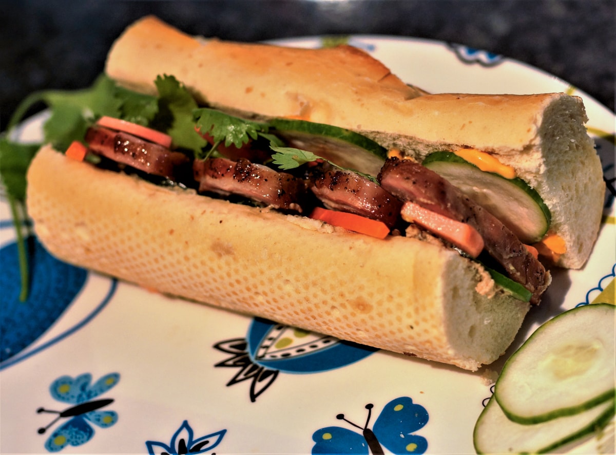 Banh Mi sandwich with grilled pork loin and pickled veggies.