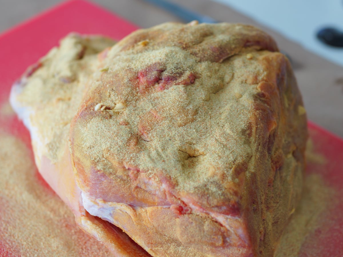 Pork picnic shoulder with seasoning.